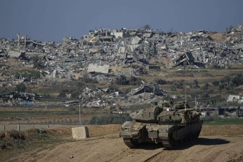 Israeli soldiers take up positions near the Gaza Strip border, in southern Israel, Sunday.
