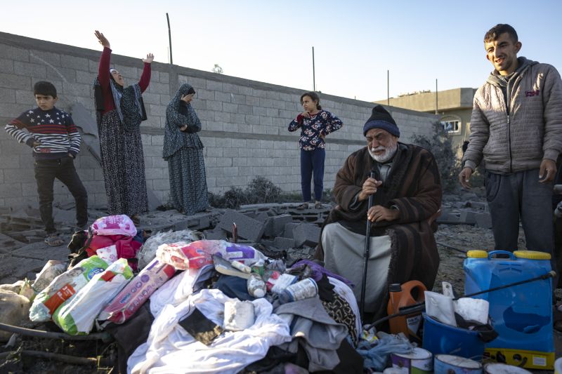 Palestinians react after their relative's home was destroyed by an Israeli airstrike in Rafah, southern Gaza Strip, Sunday.