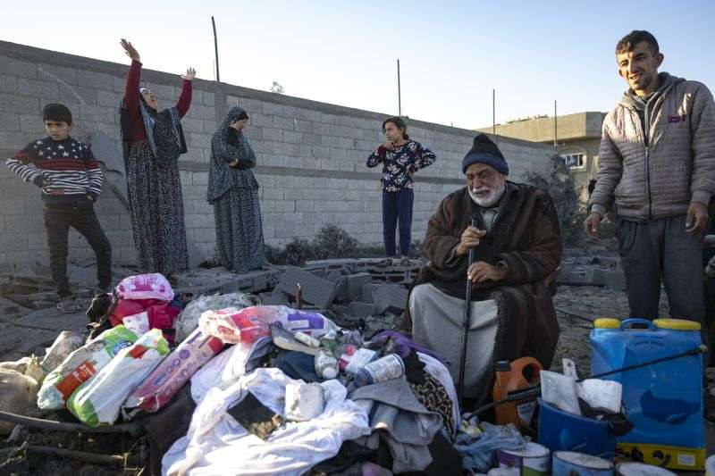 Palestinians react after their relative's home was destroyed by an Israeli airstrike in Rafah, southern Gaza Strip, Sunday.