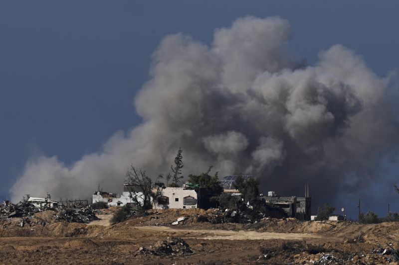 Smoke rises following an Israeli bombardment in the Gaza Strip, as seen from southern Israel, Sunday. An Israeli airstrike has killed an elite Hezbollah commander in southern Lebanon.