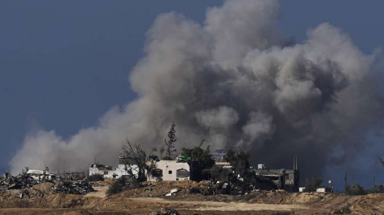 Smoke rises following an Israeli bombardment in the Gaza Strip, as seen from southern Israel, Sunday. An Israeli airstrike has killed an elite Hezbollah commander in southern Lebanon.