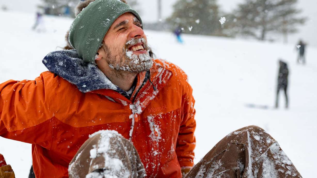 Anthony Roberts’ beard is coated in snow after sledding down a hill at Sugar House Park in Salt Lake City on Sunday. Winter storms hit the Wasatch Front over the weekend.