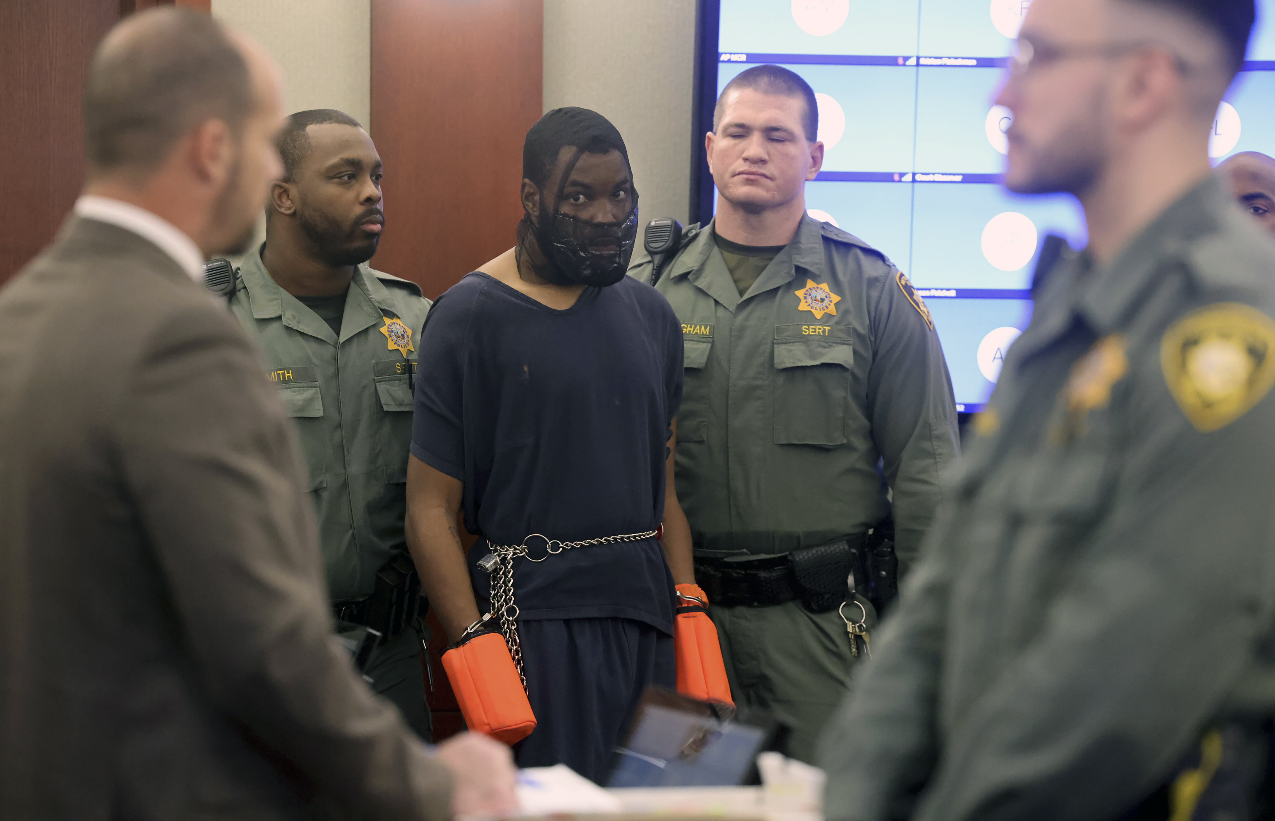 Deobra Redden is escorted into a courtroom Monday in Las Vegas. The man who was caught on camera attacking a Las Vegas judge was sentenced to up to four years in prison in an unrelated case.