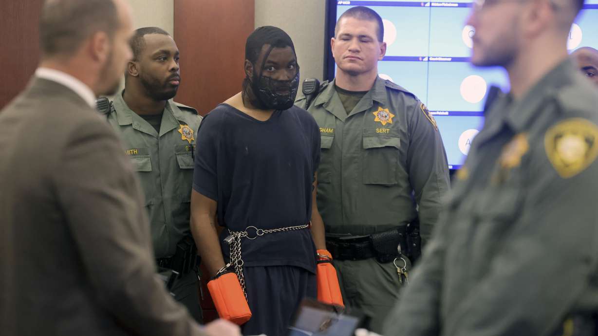 Deobra Redden is escorted into a courtroom Monday in Las Vegas. The man who was caught on camera attacking a Las Vegas judge was sentenced to up to four years in prison in an unrelated case.