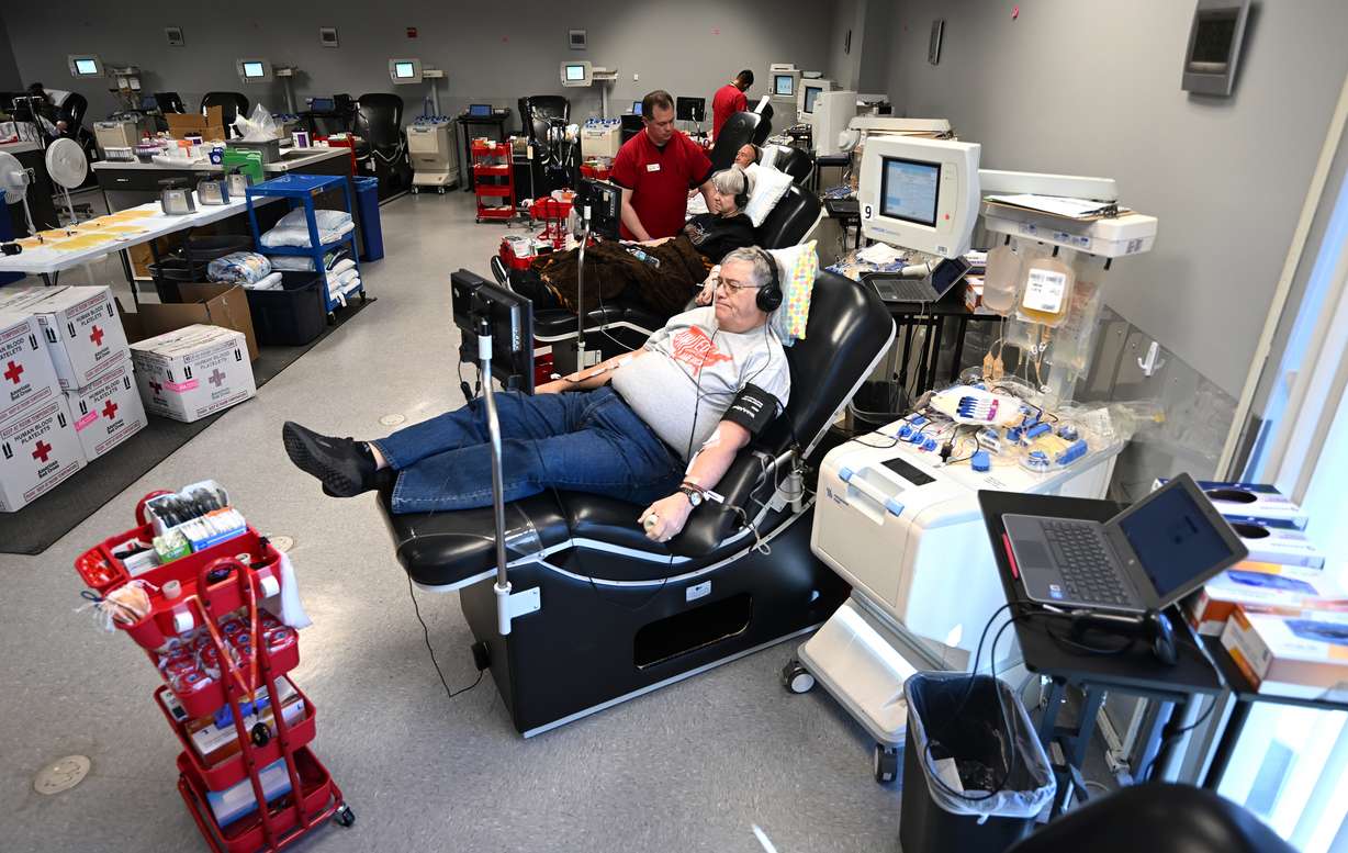John Bates and others donate blood at the American Red Cross Murray location on Monday.