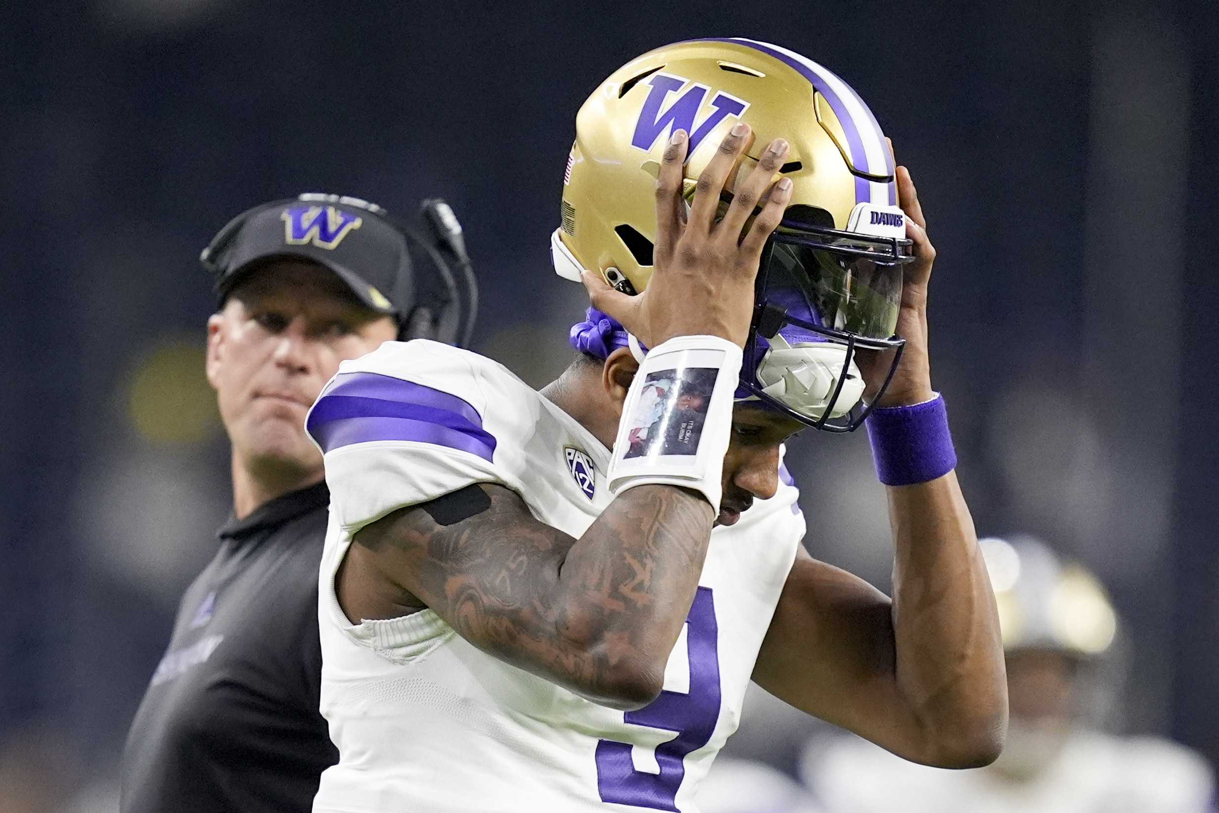 Washington quarterback Michael Penix Jr. leaves field at the end of the half against Michigan of the national championship NCAA College Football Playoff game Monday, Jan. 8, 2024, in Houston.