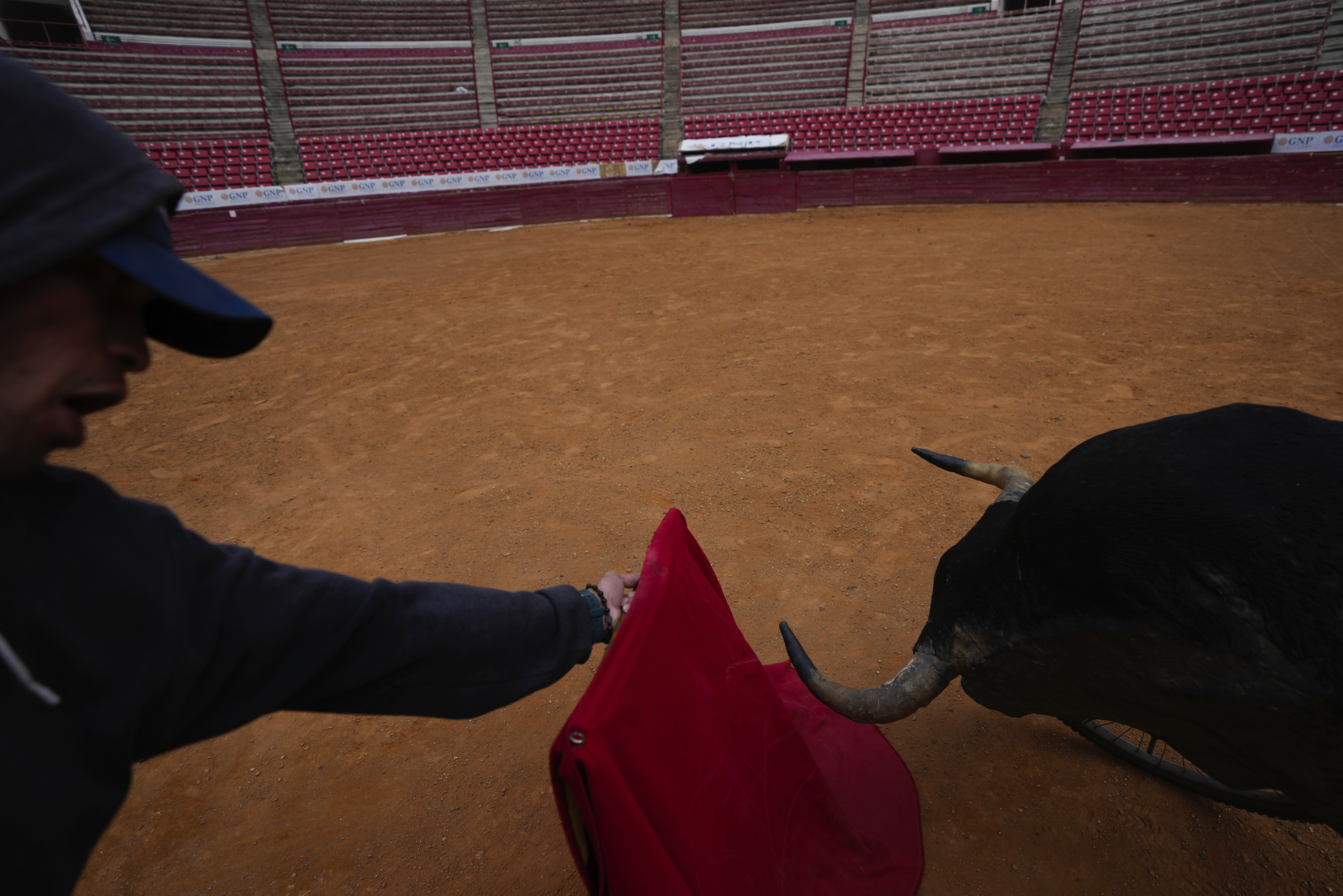 A bullfighter practices at the Plaza de Toros Mexico bullring in Mexico City, Tuesday, Dec. 12, 2023. The spectacle took a critical blow in 2022 when a judge banned bullfighting in Mexico City, but now that the country's Supreme Court of Justice has overturned the ban, the controversial sport is set to return to the capital, home to what is billed as the world's largest bullfighting ring.
