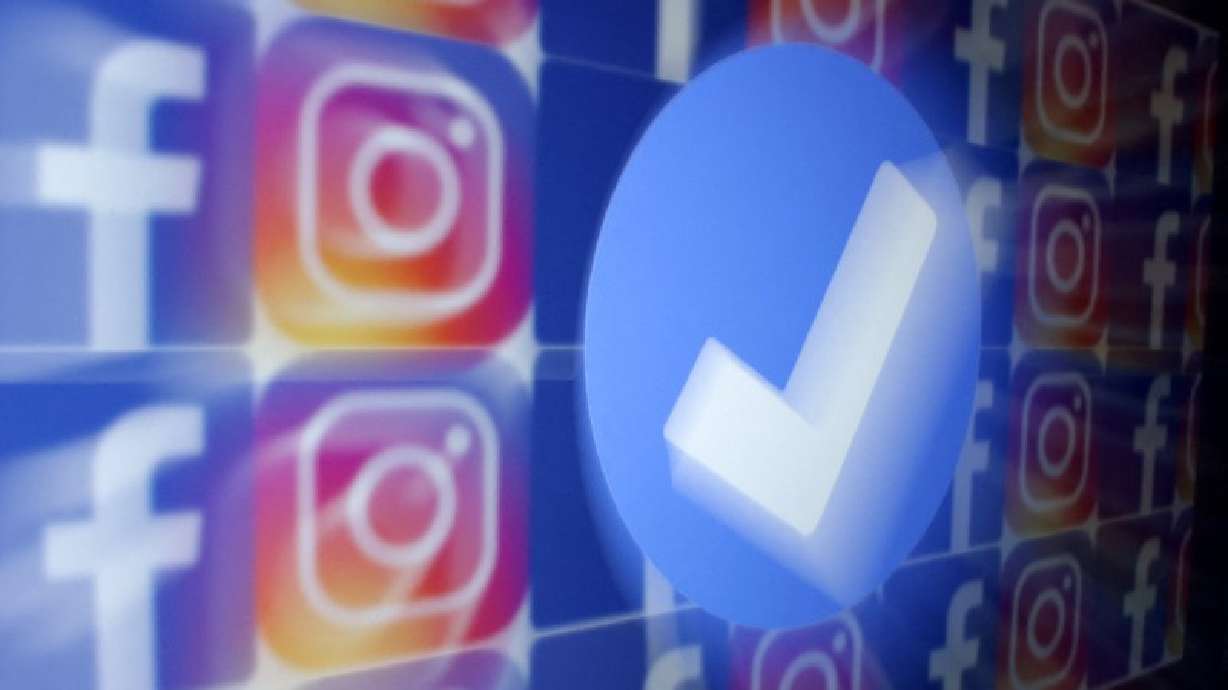 A blue verification badge and the logos of Facebook and Instagram are seen in this picture illustration taken Jan. 19, 2023.