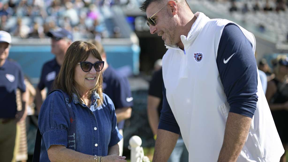 FILE - Tennessee Titans controlling owner Amy Adams Strunk talks with head coach Mike Vrabel before an NFL football game against the Jacksonville Jaguars, Sunday, Nov. 19, 2023, in Jacksonville, Fla. Strunk wants a fresh approach to compete in the NFL, so she fired coach Vrabel on Tuesday morning, Jan. 9, 2024, after six seasons and losing 18 of the past 24 games.