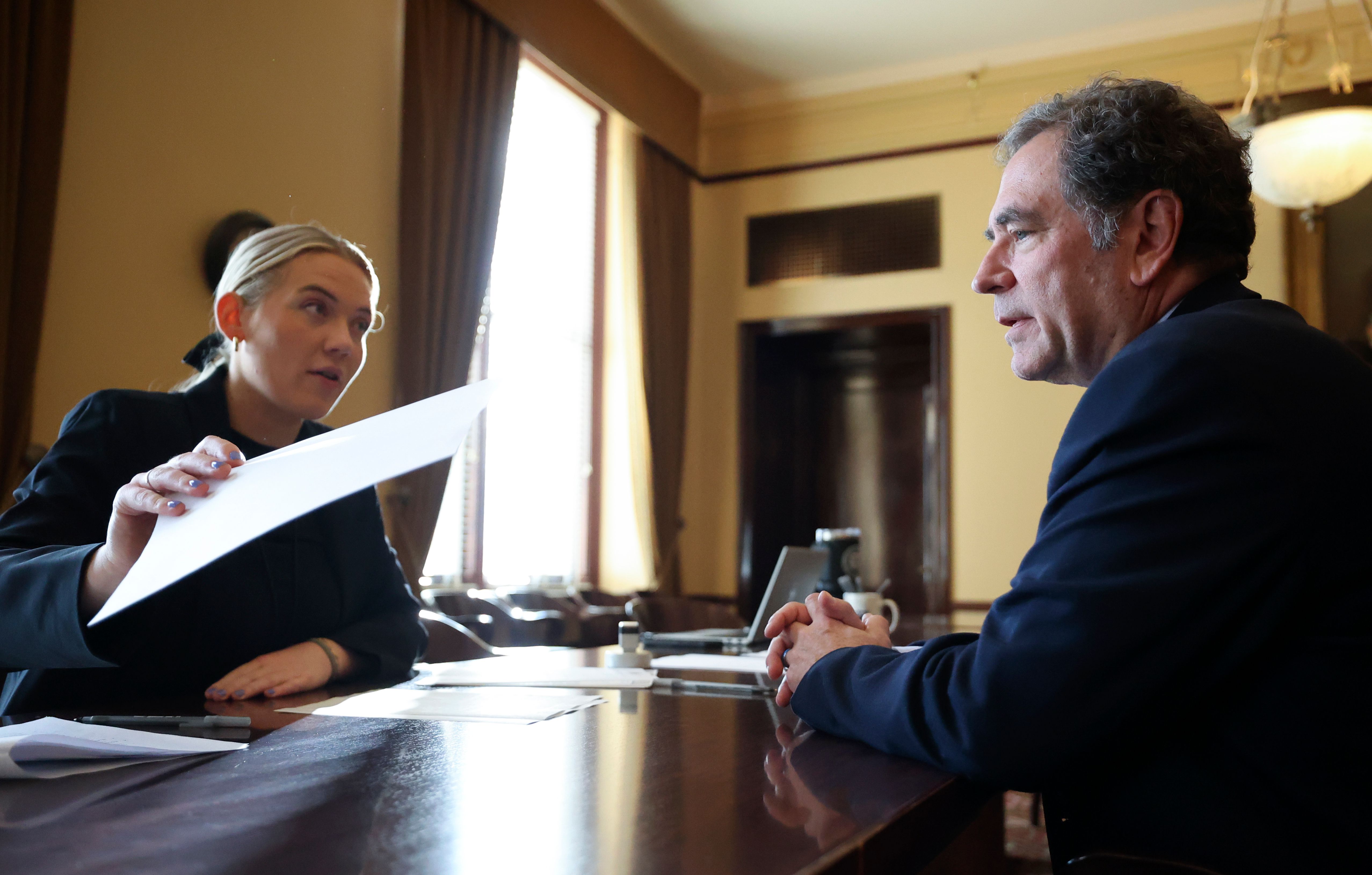 Brooke Taylor, elections coordinator for the Office of the Lieutenant Governor, helps former House Minority Leader Brian King file to run for governor at the Capitol in Salt Lake City, on Jan. 3.