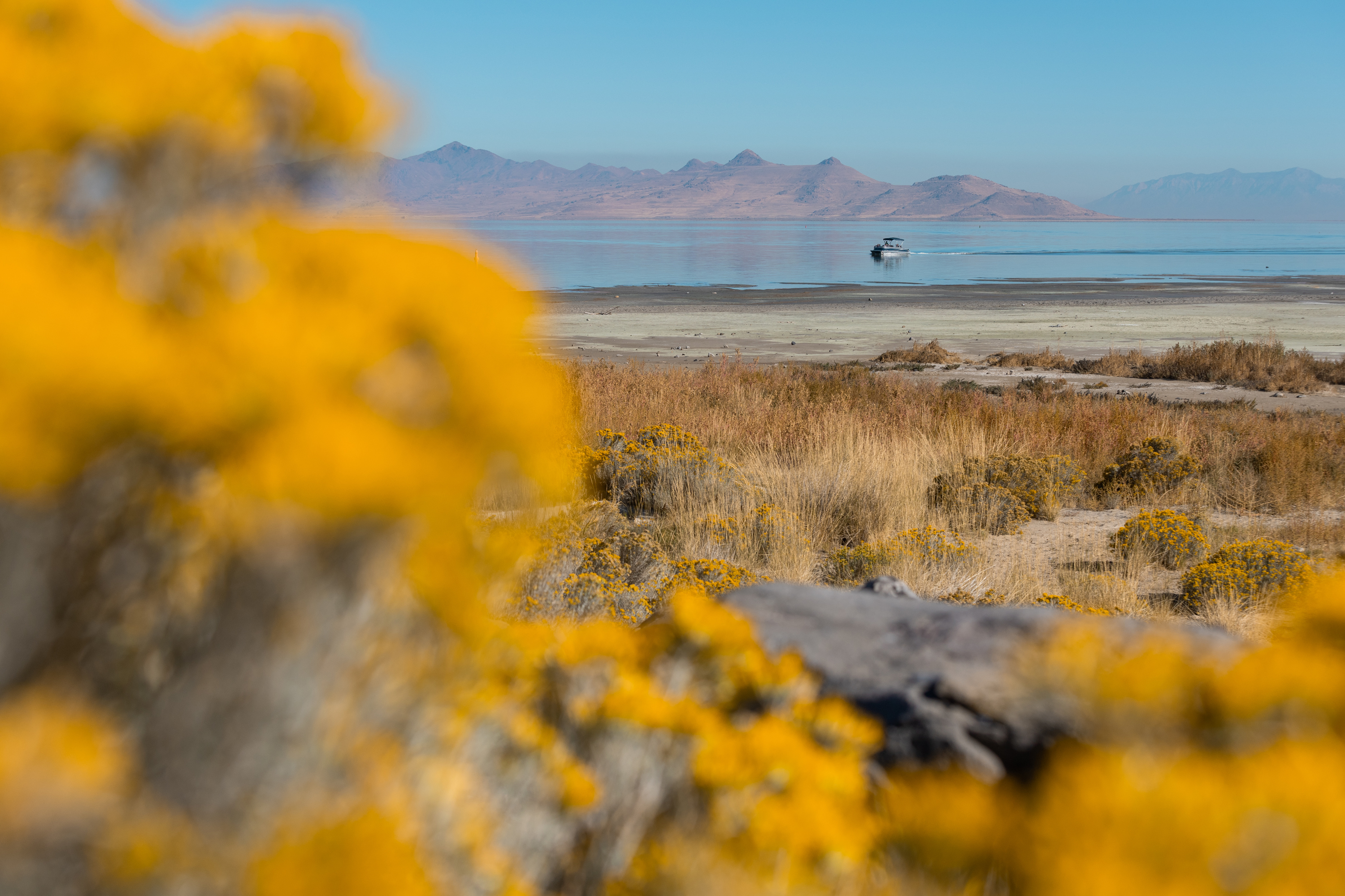 A boat goes by on the Great Salt Lake in Magna on Oct. 6, 2023. A group of state and education experts say Utah leaders will have to start taking steps soon to help the Great Salt Lake make new incremental gains in the future.