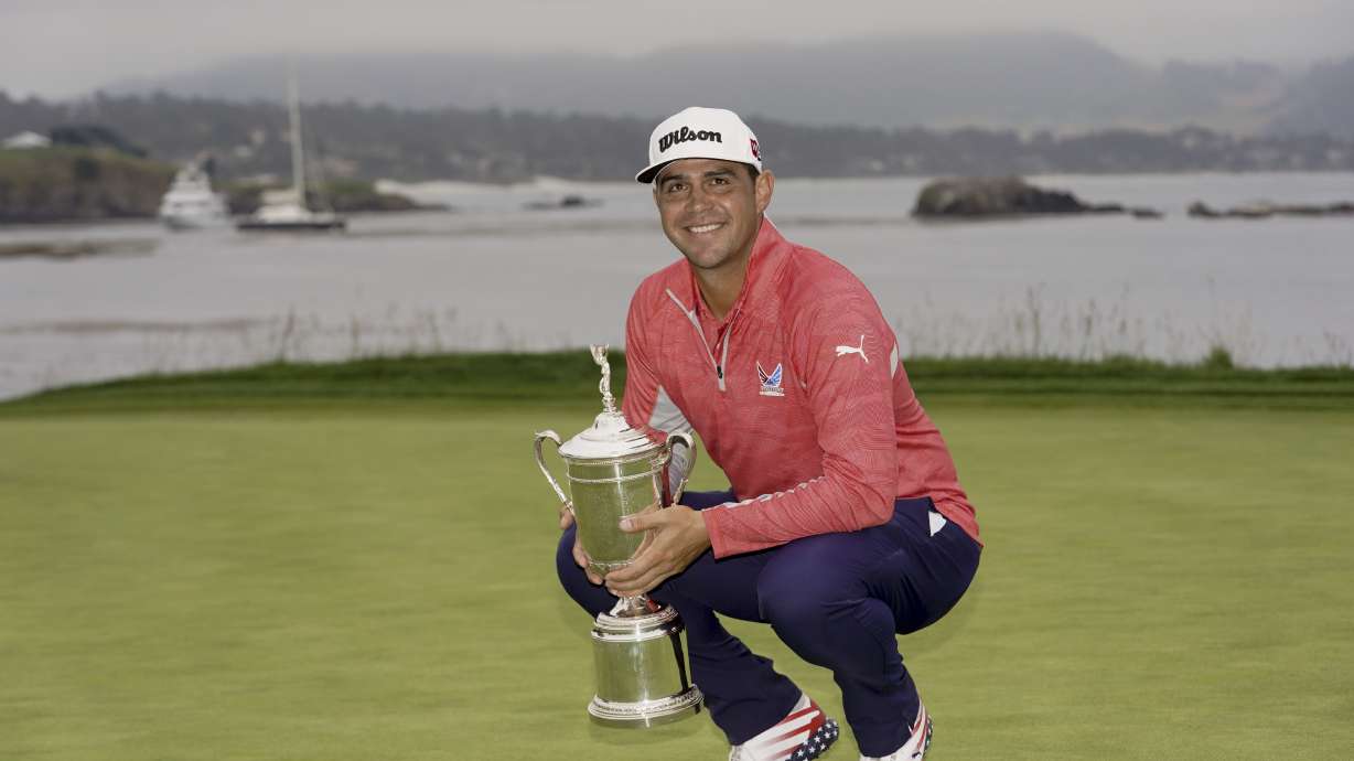 FILE - Gary Woodland poses with the trophy after winning the U.S. Open golf tournament June 16, 2019, in Pebble Beach, Calif. Woodland had brain surgery on Sept. 18, 2023. He returns to competition for the first time at the Sony Open.