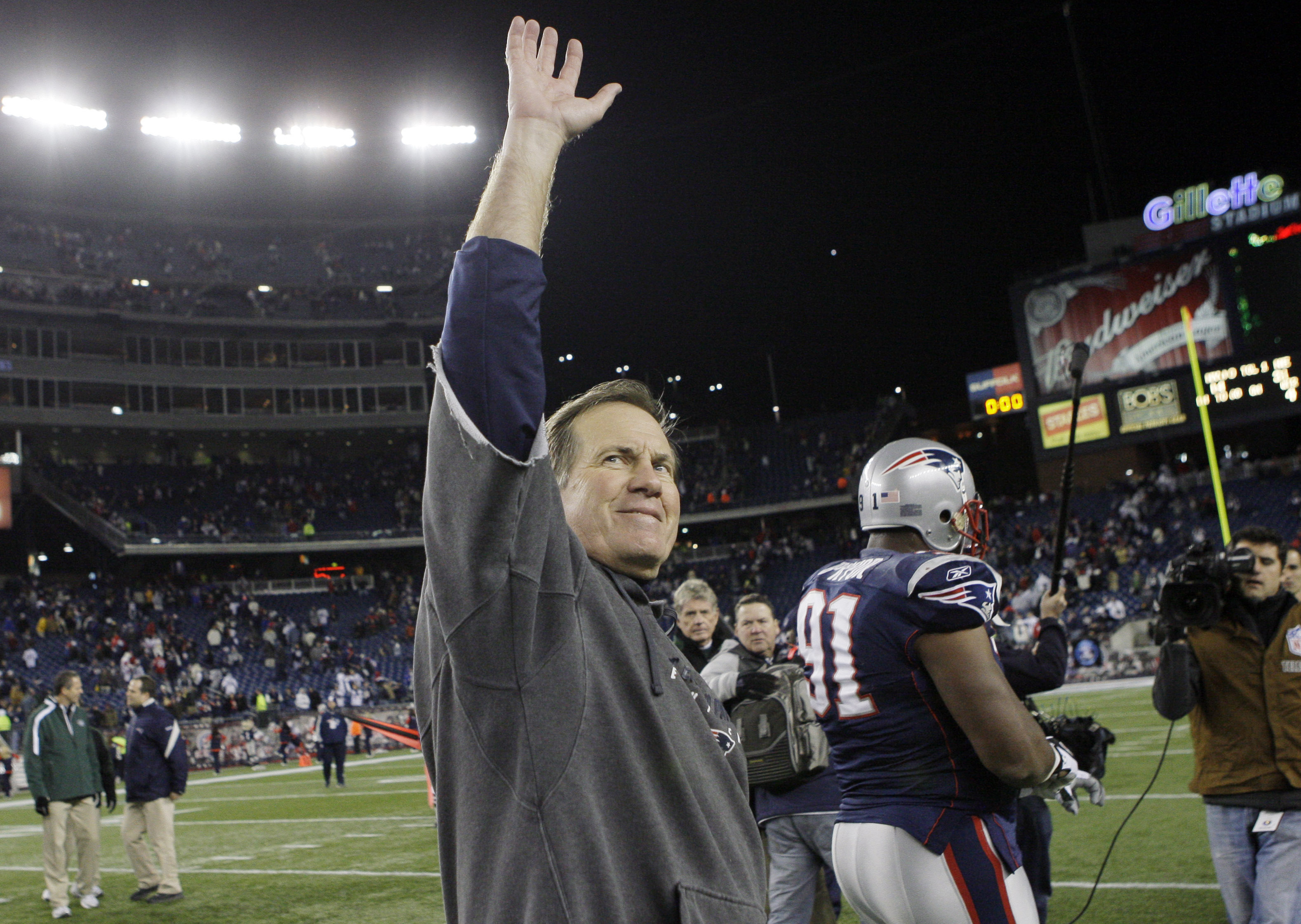 New England Patriots coach Bill Belichick waves to fans after the Patriots beat the New York Jets 31-14 in Foxborough, Mass., Nov. 22, 2009. Belichick has agreed to part ways as the coach of the New England Patriots on Thursday, bringing an end to his 24-year tenure as the architect of the most decorated dynasty of the league’s Super Bowl era.