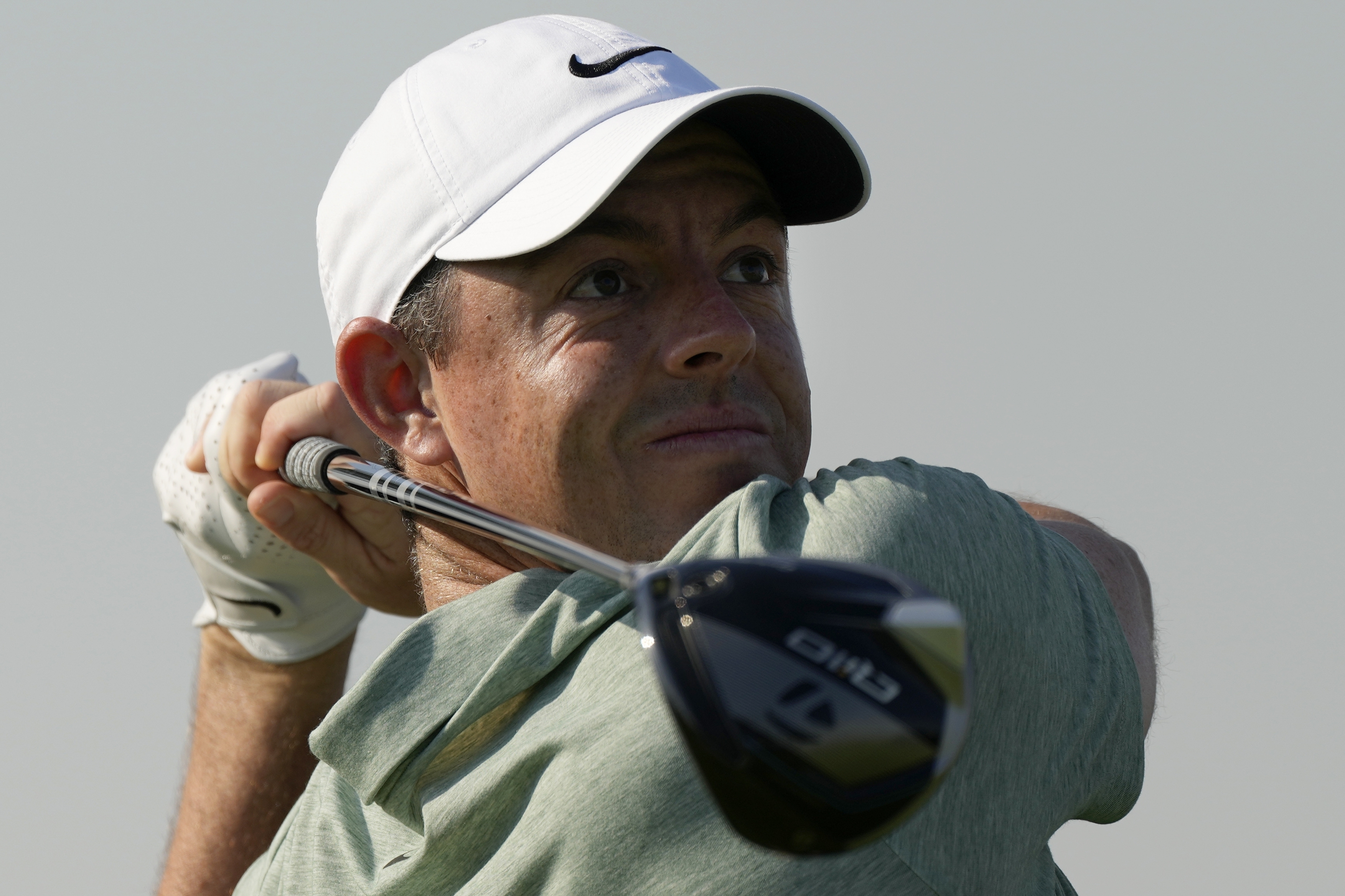 Rory McIlroy of Northern Ireland tees off on the 11th hole during the first round of Dubai Invitational golf tournament, in Dubai, United Arab Emirates, Thursday, Jan. 11, 2024. 