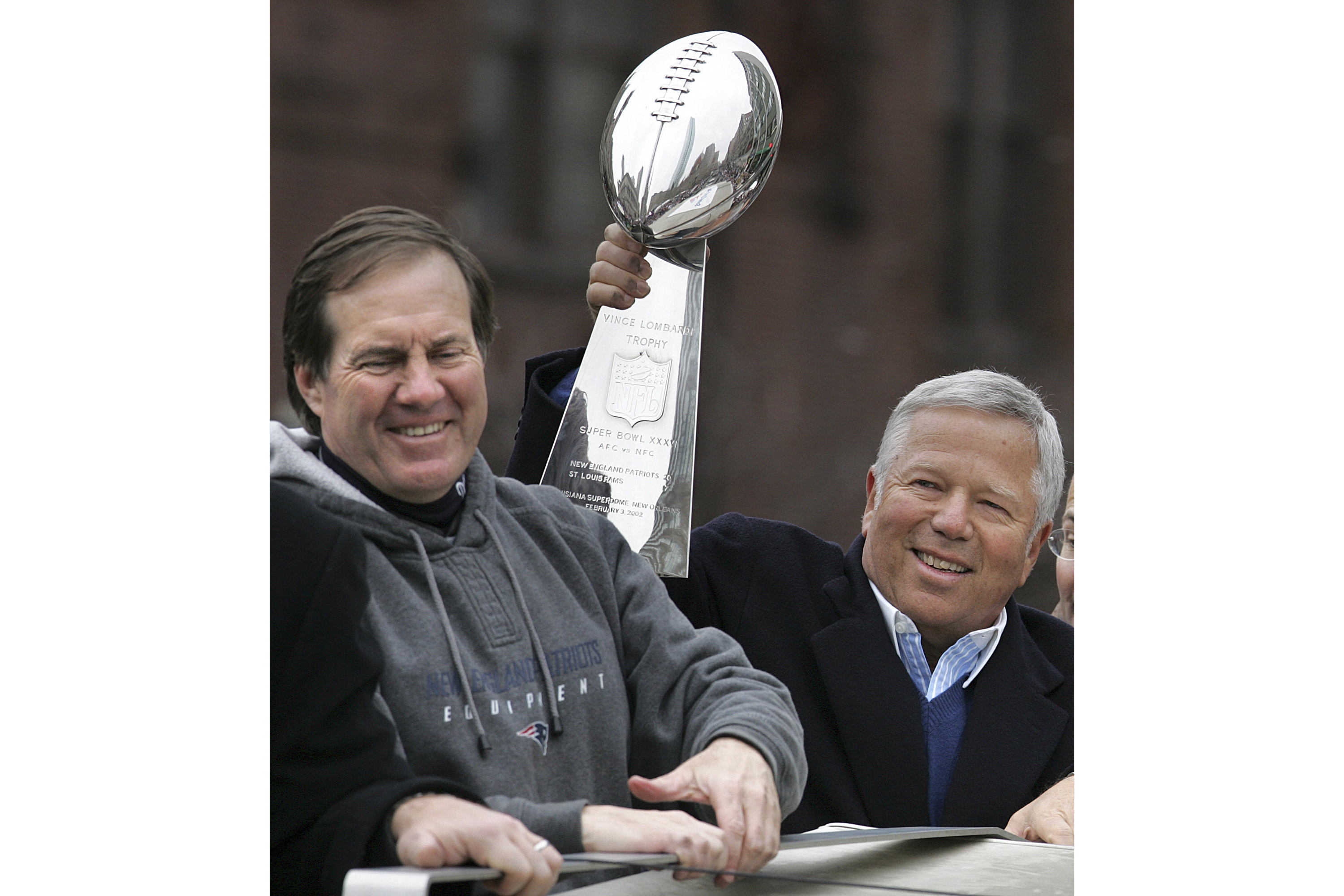 FILE - New England Patriots head coach Bill Belichick, left, smiles as team owner Robert Kraft holds up the Vince Lombardi trophy during a Super Bowl victory parade in Boston, Tuesday, Feb . 8, 2005. The Patriots beat the Philadelphia Eagles 24-21 in Super Bowl XXXIX. Six-time NFL champion Bill Belichick has agreed to part ways as the coach of the New England Patriots on Thursday, Jan. 11, 2024, bringing an end to his 24-year tenure as the architect of the most decorated dynasty of the league’s Super Bowl era, a source told the Associated Press on the condition of anonymity because it has not yet been announced. 