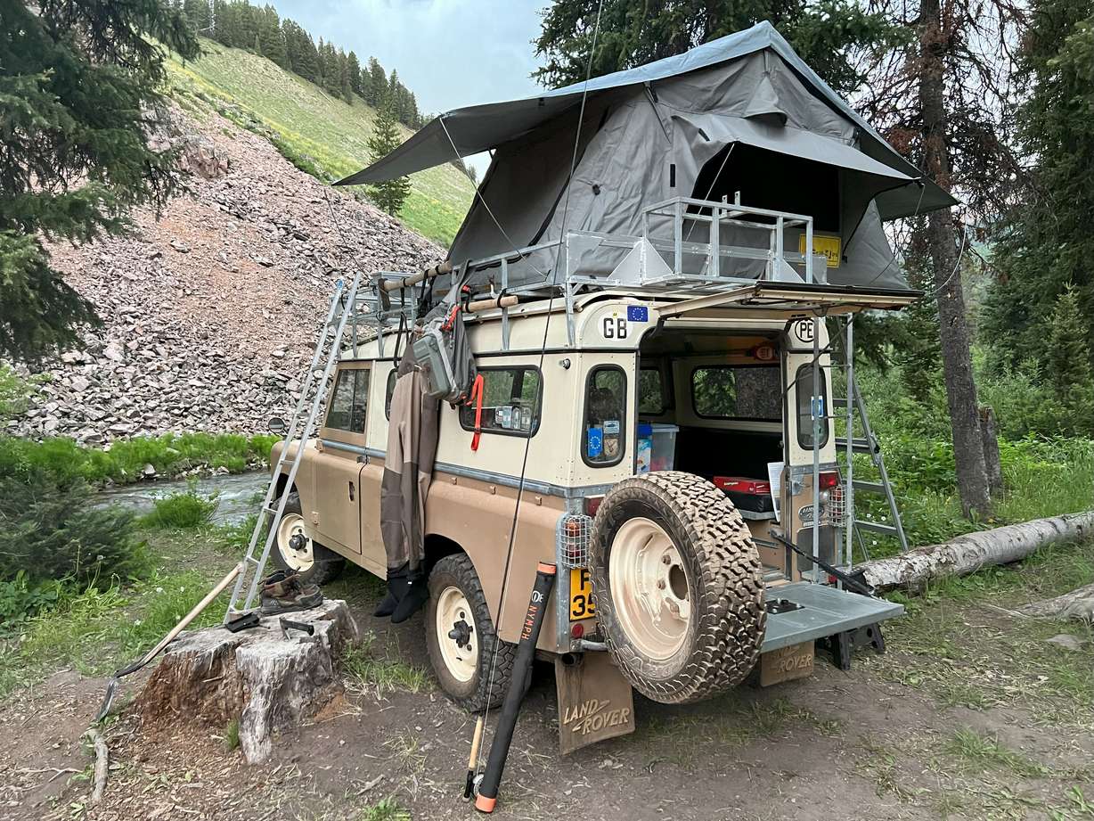 Jeremy Jenkins' 1976 Land Rover Series III setting up camp on Greys River in Wyoming.