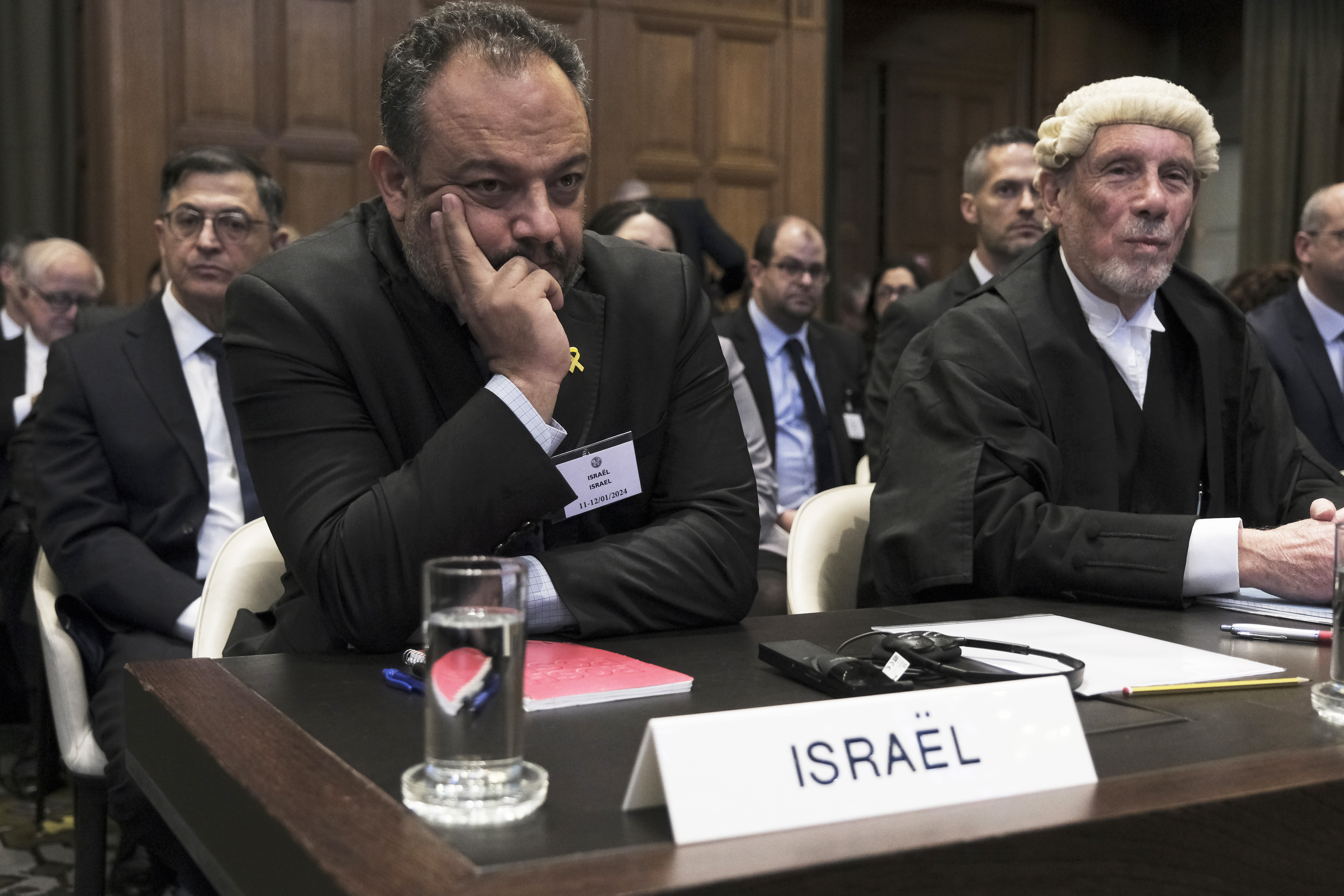 British jurist Malcolm Shaw, right, legal adviser to Israel's Foreign Ministry Tal Becker, left, look on during the opening of the hearings at the International Court of Justice in The Hague, Netherlands, Thursday. Israel is insisting at the United Nations' highest court that its war in Gaza is a legitimate defense of its people.