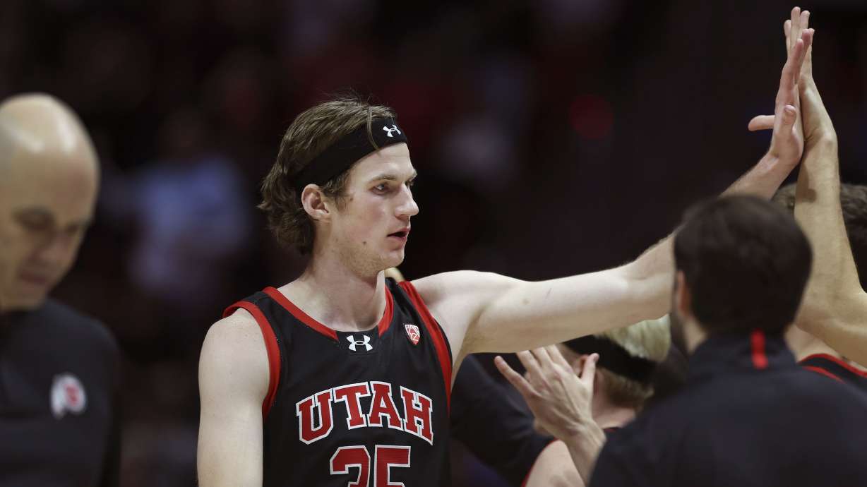 Utah Utes center Branden Carlson (35) is congratulated as he returns to the bench in the game against UCLA at the University of Utah’s Huntsman Center in Salt Lake City on Thursday, Jan. 11, 2024.