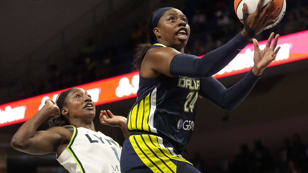 FILE - Dallas Wings guard Arike Ogunbowale (24) shoots next to Minnesota Lynx guard Diamond Miller, left, during the first half of a WNBA basketball game Aug. 24, 2023, in Arlington, Texas. The WNBA is using some fresh faces in its Player Marketing Agreement cohort this season. The league's past two Rookie of the Year winners Aliyah Boston, of Indiana, and Rhyne Howard, of Atlanta, are two of the six players chosen this offseason to take part in the program. They are joined by Washington's Shakira Austin, Connecticut's Brionna Jones, Seattle's Jewell Loyd and Ogunbowale.