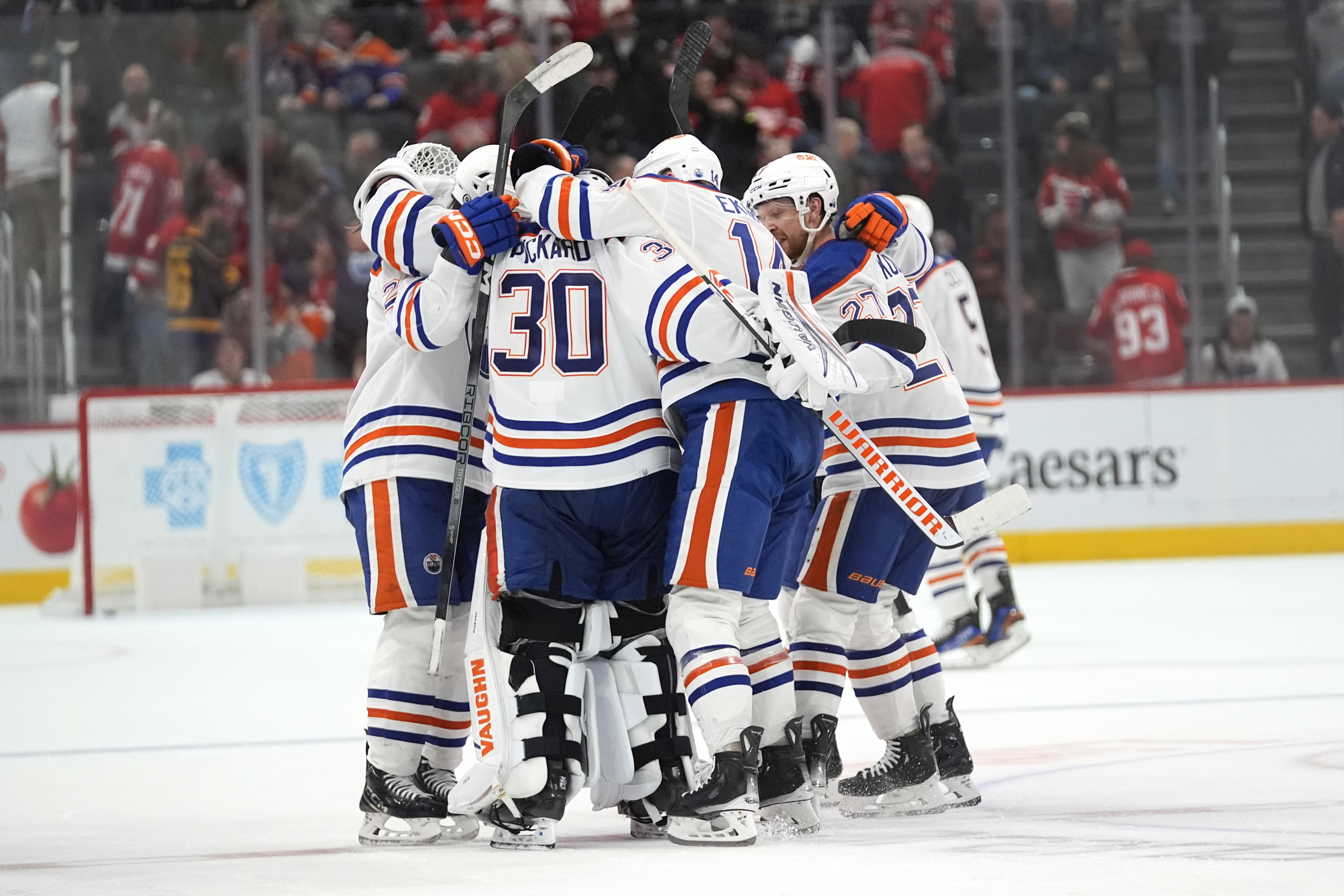 Edmonton Oilers goaltender Calvin Pickard (30) celebrates with teammates after beating the Detroit Red Wings in overtime during an NHL hockey game Thursday, Jan. 11, 2024, in Detroit.