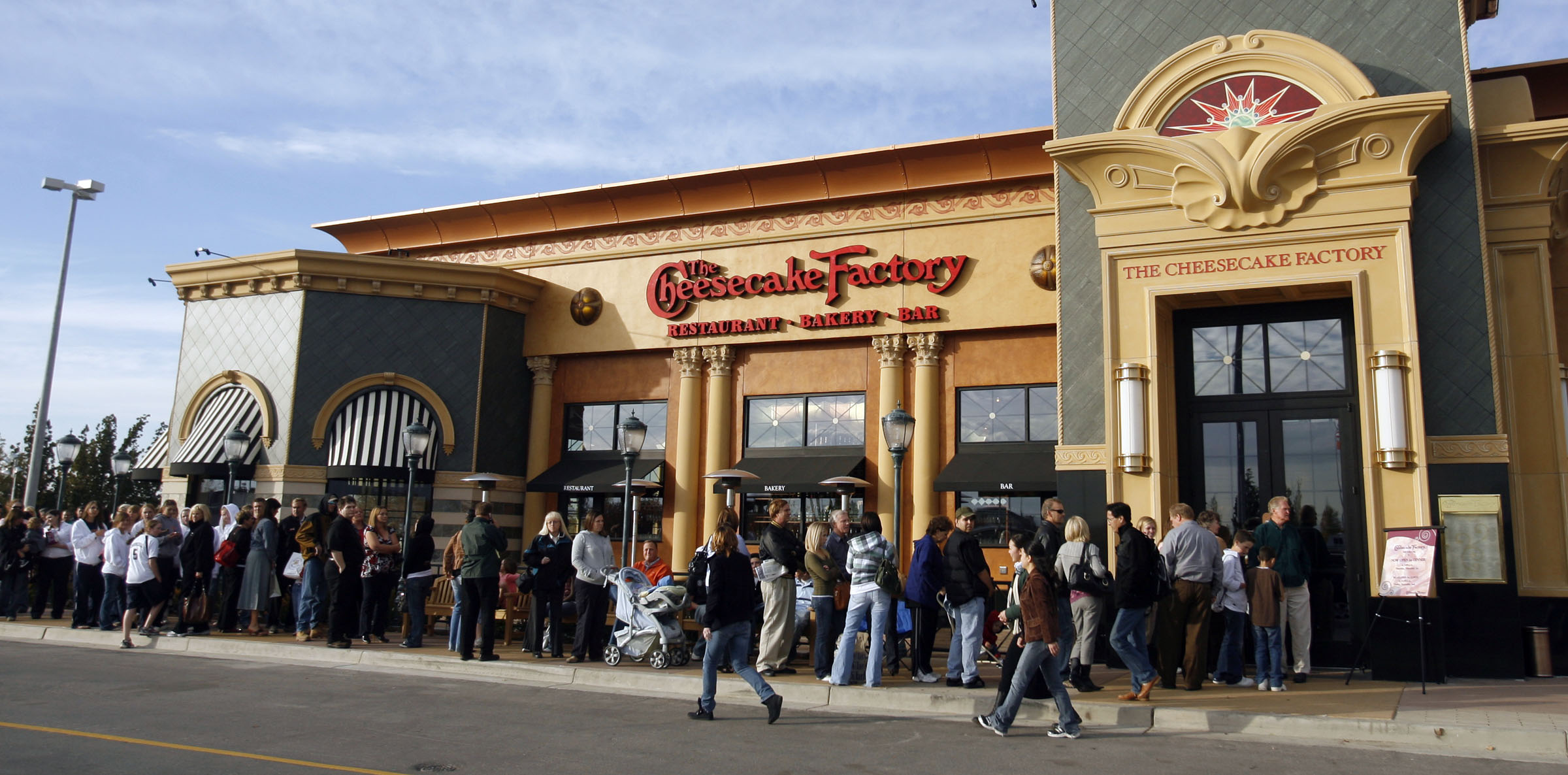 Patrons line up outside the Cheesecake Factory in Murray as the restaurant opens its doors for business Thursday, Nov. 1, 2007. Why are so many willing to wait in line for hours when a new store opens? 