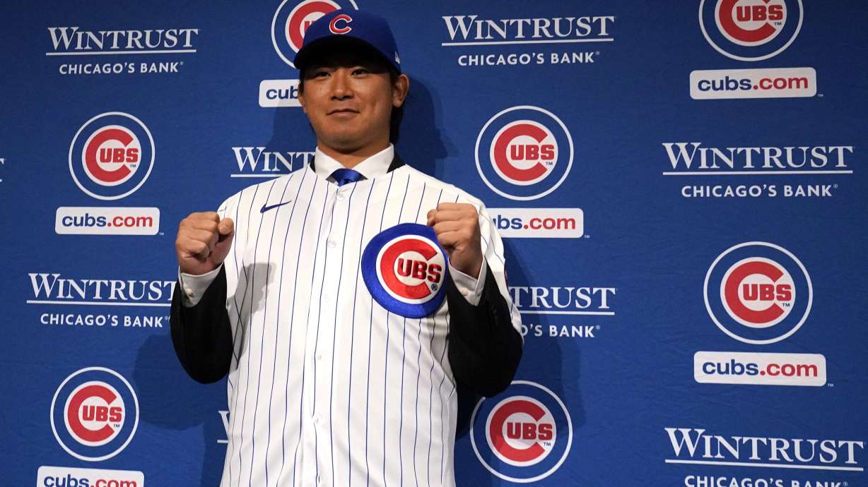 New Chicago Cubs pitcher Shōta Imanaga poses with his jersey during a news conference Friday, Jan. 12, 2024, in Chicago. The Japanese left-hander is expected to step right into the baseball team's rotation as it tries to return to the playoffs for the first time since 2020.