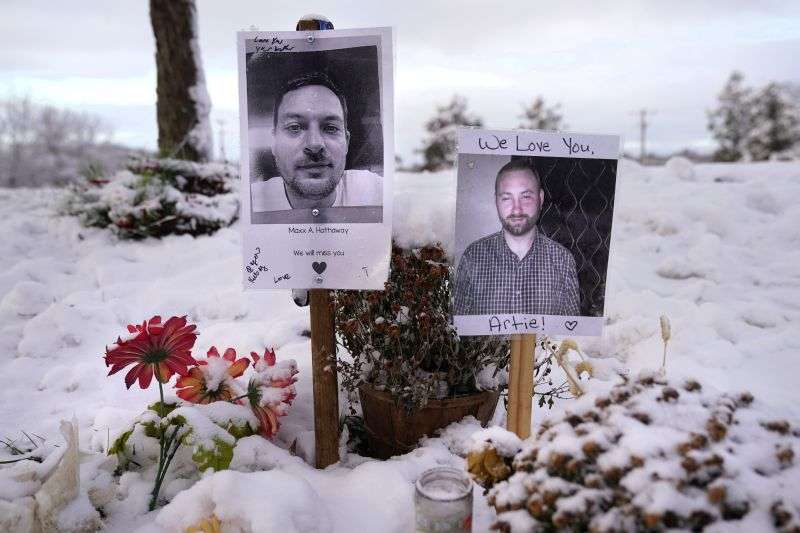 Pictures of two of the victims of the October 2023 mass shooting by Army reservist Robert Card are seen at a makeshift memorial in Lewiston, Maine, Dec. 5, 2023.