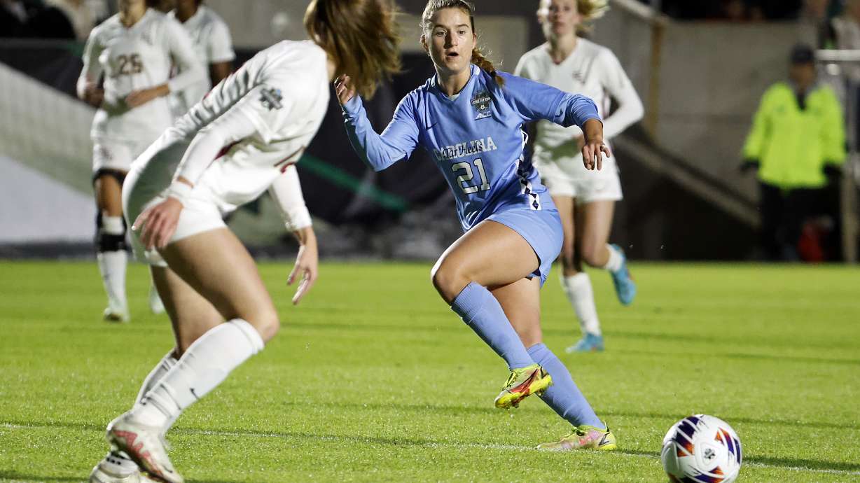 FILE - North Carolina's Ally Sentnor (21) passes the ball during the first half of the team's NCAA College Cup semifinal soccer match against Florida State in Cary, N.C., Dec. 2, 2022. Two players from North Carolina, Sentnor and Savy King, were selected with the top two picks in the National Women's Soccer League draft Friday night, Jan. 12, 2024. Sentnor, the ACC Midfielder of the Year, went with the No. 1 pick overall to the expansion Utah Royals. As a sophomore last year she had 11 goals and seven assists.