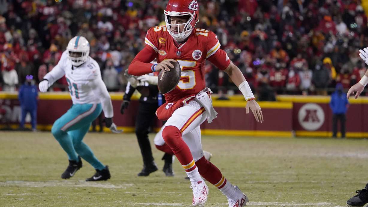 Kansas City Chiefs quarterback Patrick Mahomes (15) runs against the Miami Dolphins during the second half of an NFL wild-card playoff football game Saturday, Jan. 13, 2024, in Kansas City, Mo.