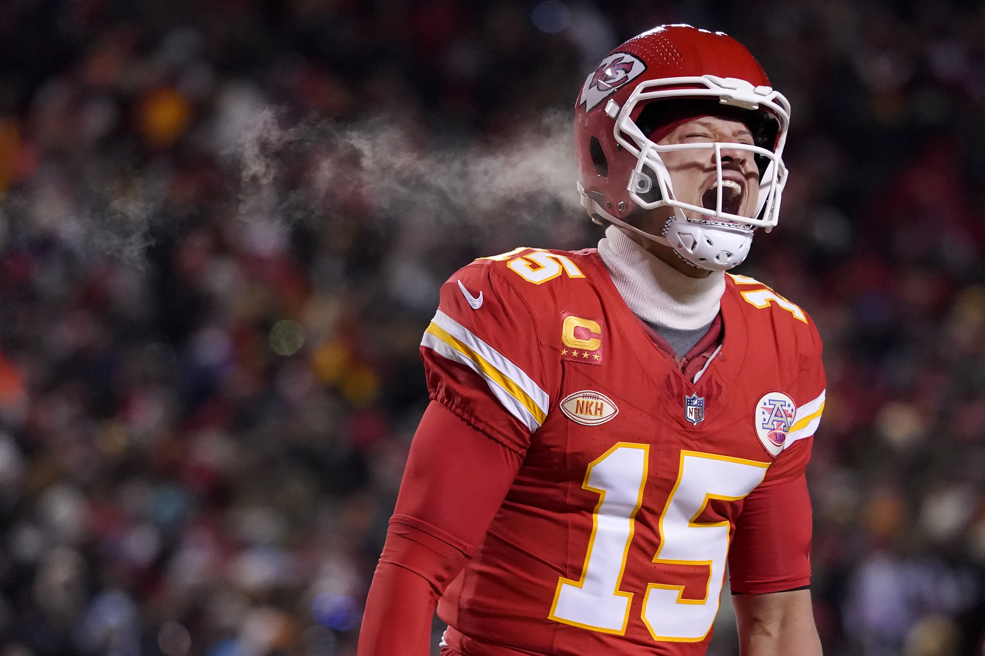 Kansas City Chiefs quarterback Patrick Mahomes (15) celebrates after throwing a touchdown pass during the first half of an NFL wild-card playoff football game against the Miami Dolphins Saturday, Jan. 13, 2024, in Kansas City, Mo. 