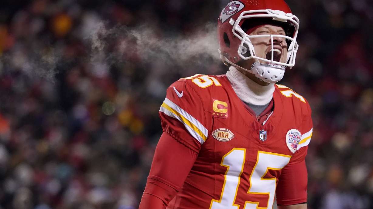 Kansas City Chiefs quarterback Patrick Mahomes (15) celebrates after throwing a touchdown pass during the first half of an NFL wild-card playoff football game against the Miami Dolphins Saturday, Jan. 13, 2024, in Kansas City, Mo.