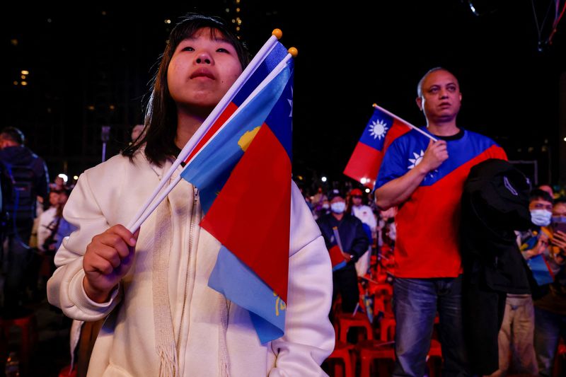 A woman looks on after the preliminary results of the presidential and parliamentary elections, in New Taipei City, Taiwan, Jan.13.