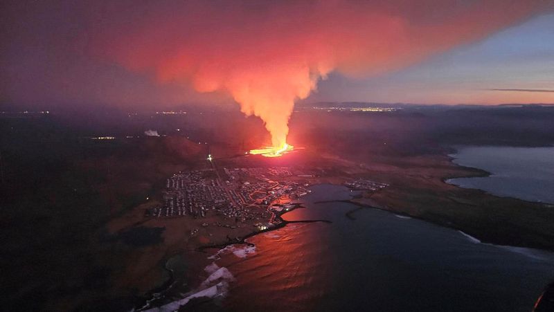 A volcano spews lava and smoke as it erupts in Reykjanes Peninsula, Iceland, Jan. 14.