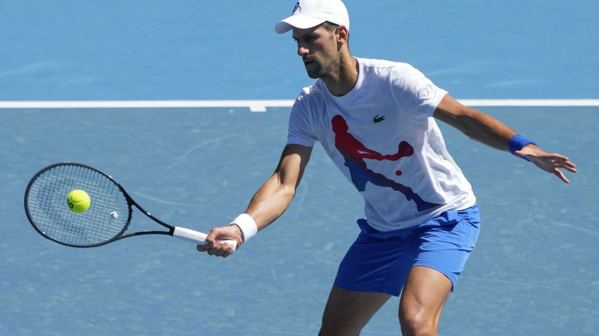 Serbia's Novak Djokovic plays a forehand return to during a practice session on Rod Laver Arena ahead of the Australian Open tennis championships at Melbourne Park, Melbourne, Australia, Friday, Jan. 12, 2024.