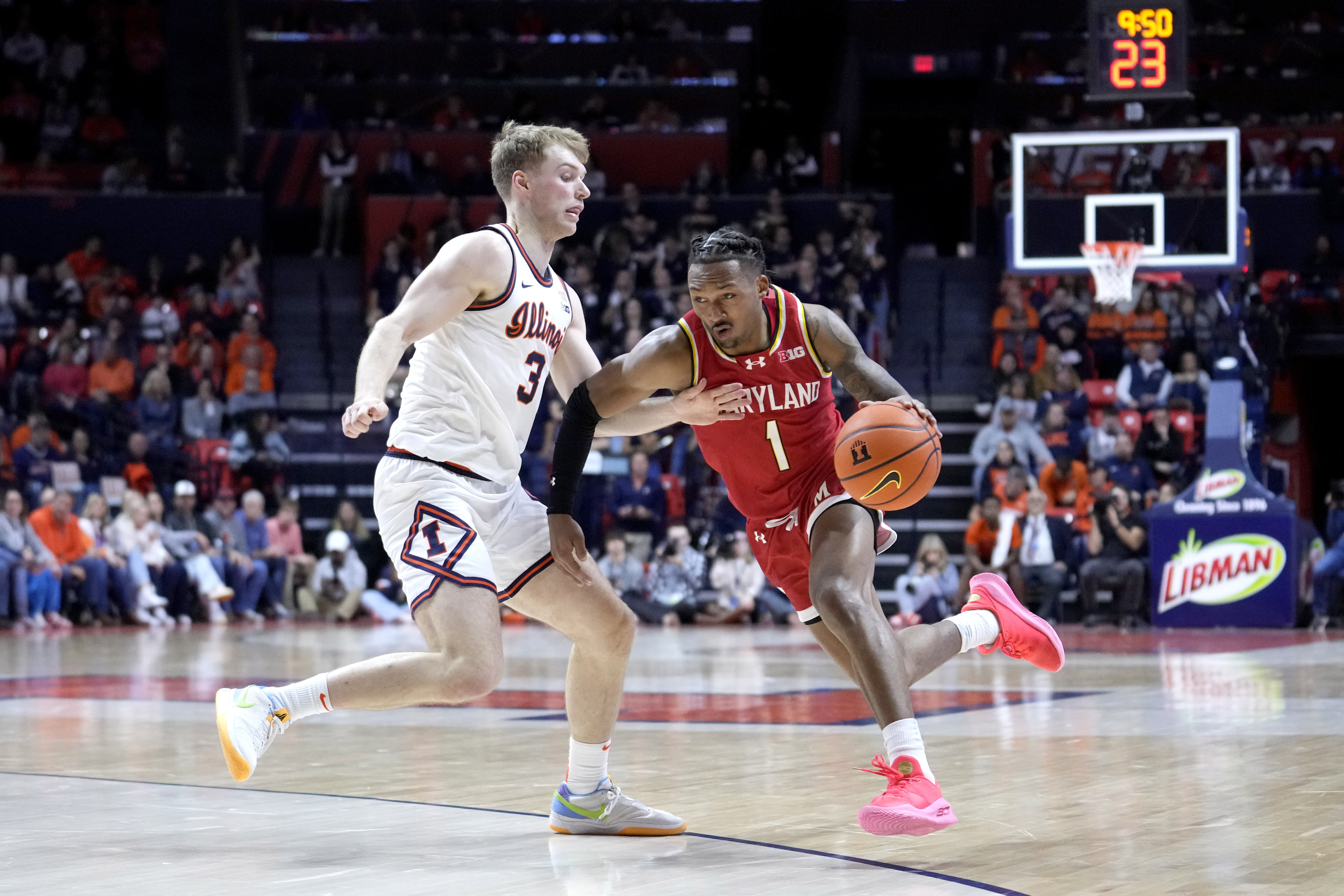 Maryland's Jahmir Young (1) drives to the basket as Illinois' Marcus Domask defends during the second half of an NCAA college basketball game Sunday, Jan. 14, 2024, in Champaign, Ill. Maryland won 76-67. 
