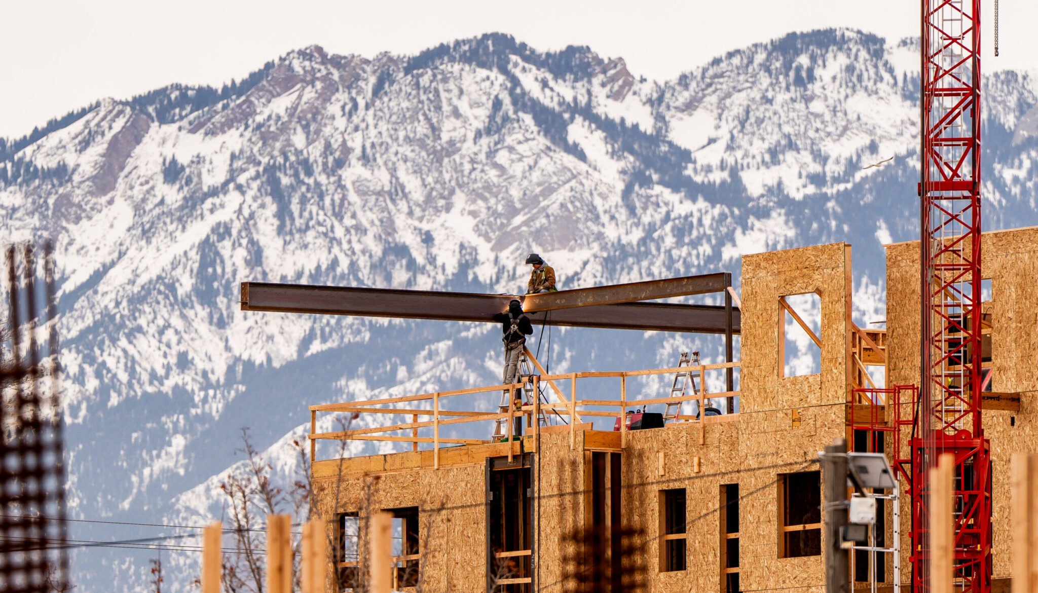 Construction crews work on a new housing development along 300 West in Salt Lake City on Jan. 3. A higher demand for transportation options emerges as Utah grows, urban planners said.