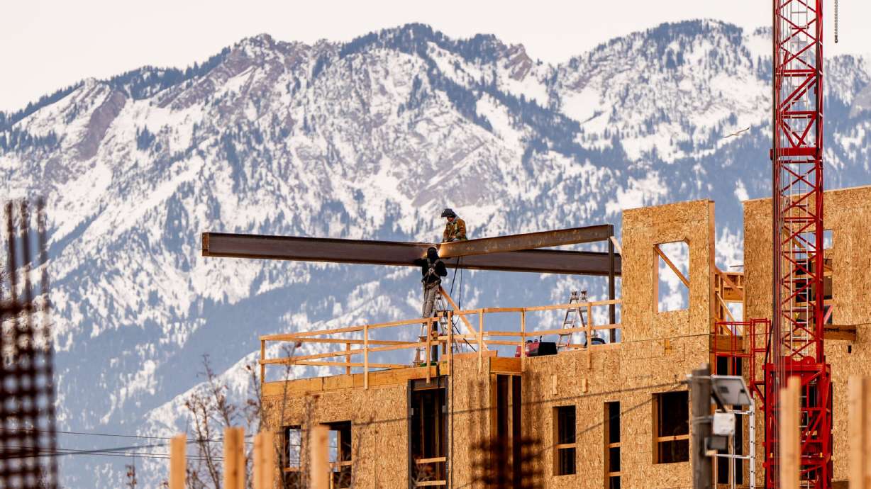 Construction crews work on a new housing development along 300 West in Salt Lake City on Jan. 3.