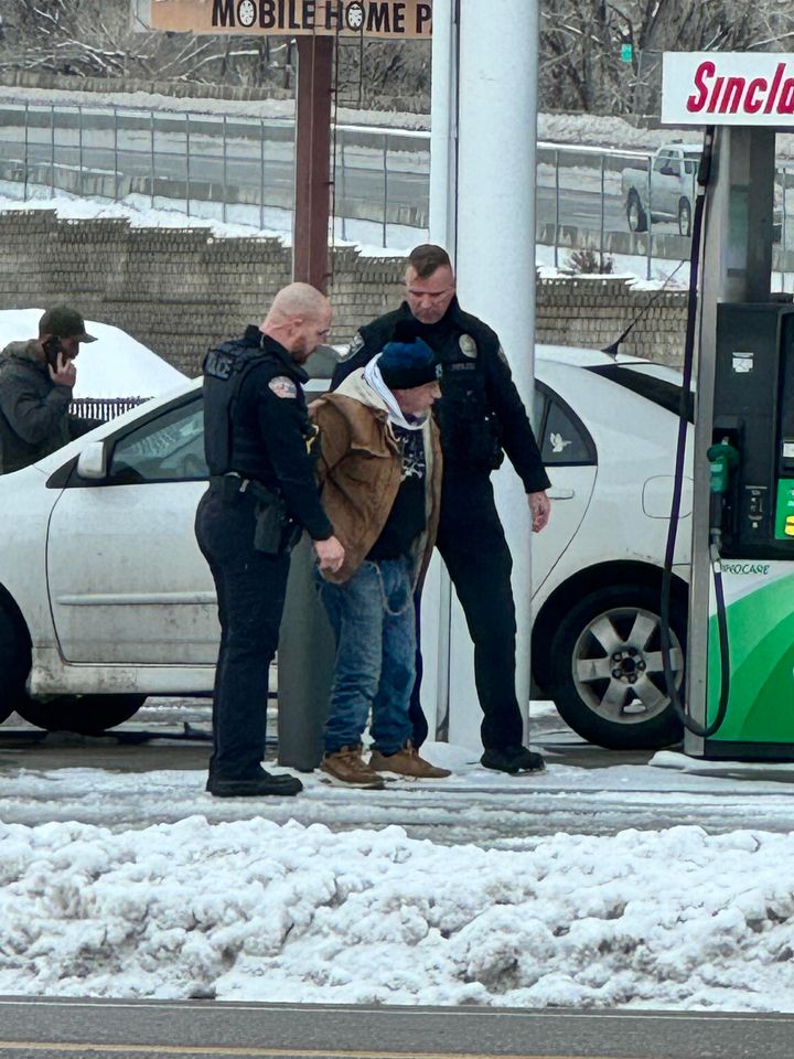 Ogden police detain an unnamed man at the Sinclair station on Riverdale Road Sunday afternoon.