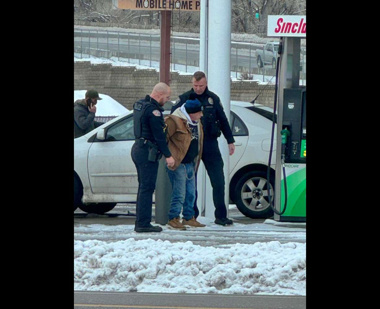 Ogden police detain an unnamed man at the Sinclair station on Riverdale Road Sunday afternoon.