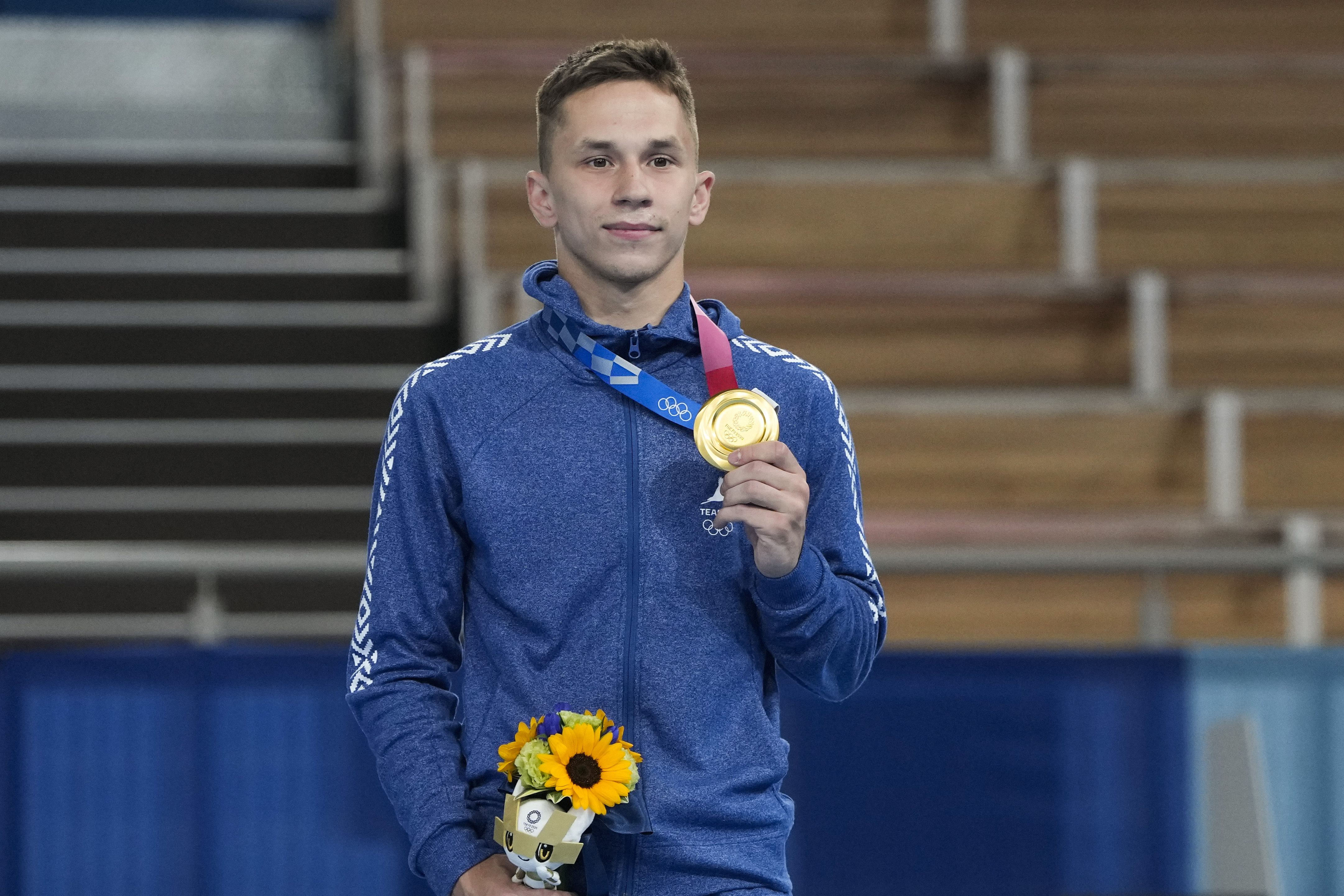 FILE - Gold medallist Ivan Litvinovich, of Belarus, poses for a photo during a medal ceremony after men's trampoline gymnastics at the 2020 Summer Olympics, on July 31, 2021, in Tokyo. The International Gymnastics Federation said Monday Jan. 15, 2024 it gave neutral status for competitions to 30 athletes and officials from Belarus though it is unclear how any could still qualify for the Paris Olympics. The only Belarusian gold medalist at the Tokyo Olympics, trampoline gymnast Ivan Litvinovich, is on the FIG list of approved people who could return to international competitions during the military invasion of Ukraine by Russia which Belarus supports. 