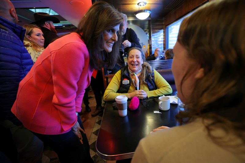 Republican presidential candidate and former Ambassador to the United Nations Nikki Haley greets diners during a campaign stop at the Drake Diner on the day of the Iowa Caucus vote in Des Moines, Iowa, Monday.