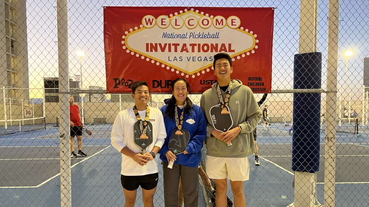 Matthew Liu, Swan Saunders and Calvin Bishara pose for a photo after competing in a national pickleball tournament in Las Vegas in October 2023.