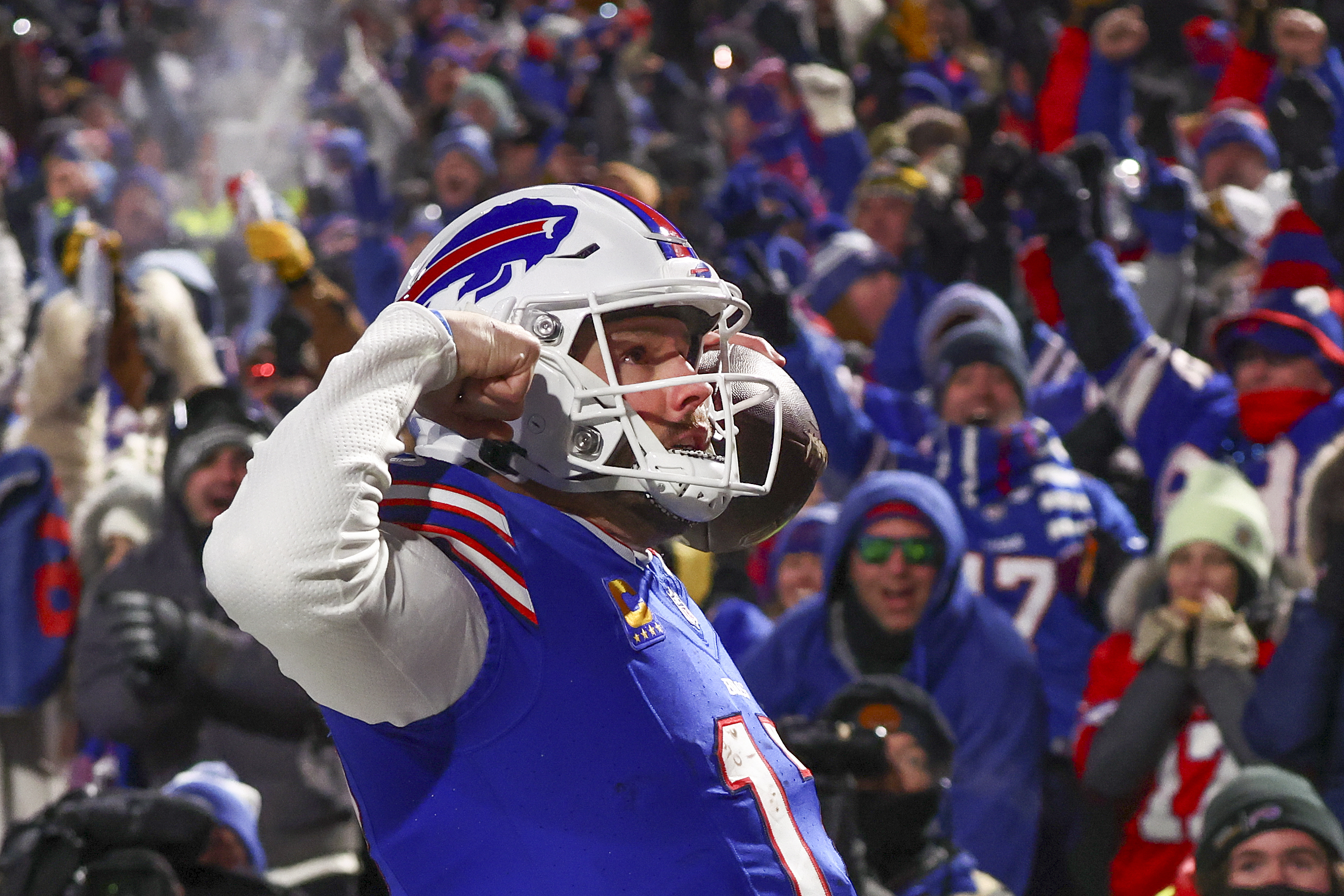 Buffalo Bills quarterback Josh Allen (17) reacts to the crowd after scoring a touchdown against the Pittsburgh Steelers during the second quarter of an NFL wild-card playoff football game, Monday, Jan. 15, 2024, in Buffalo, N.Y. 