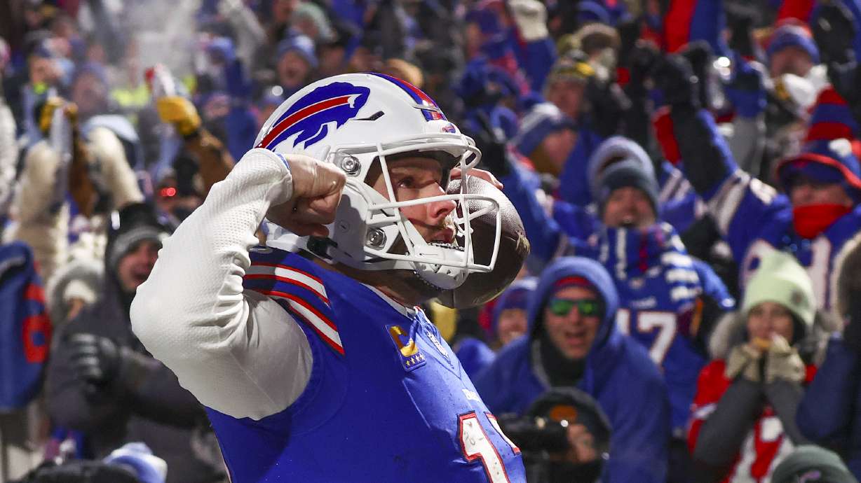 Buffalo Bills quarterback Josh Allen (17) reacts to the crowd after scoring a touchdown against the Pittsburgh Steelers during the second quarter of an NFL wild-card playoff football game, Monday, Jan. 15, 2024, in Buffalo, N.Y.