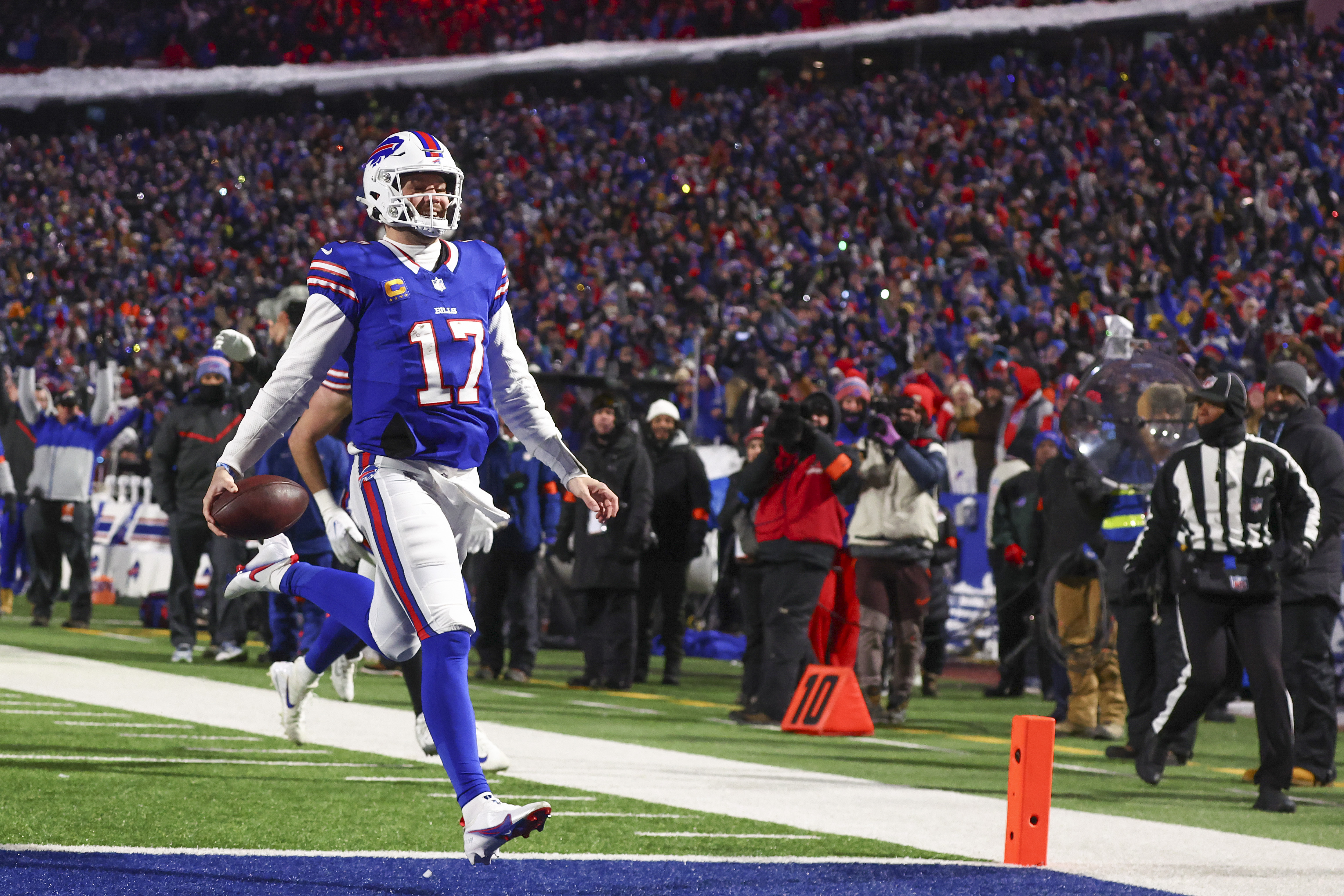 Buffalo Bills quarterback Josh Allen (17) crosses the goal line for a touchdown against the Pittsburgh Steelers during the second quarter of an NFL wild-card playoff football game, Monday, Jan. 15, 2024, in Buffalo, N.Y.