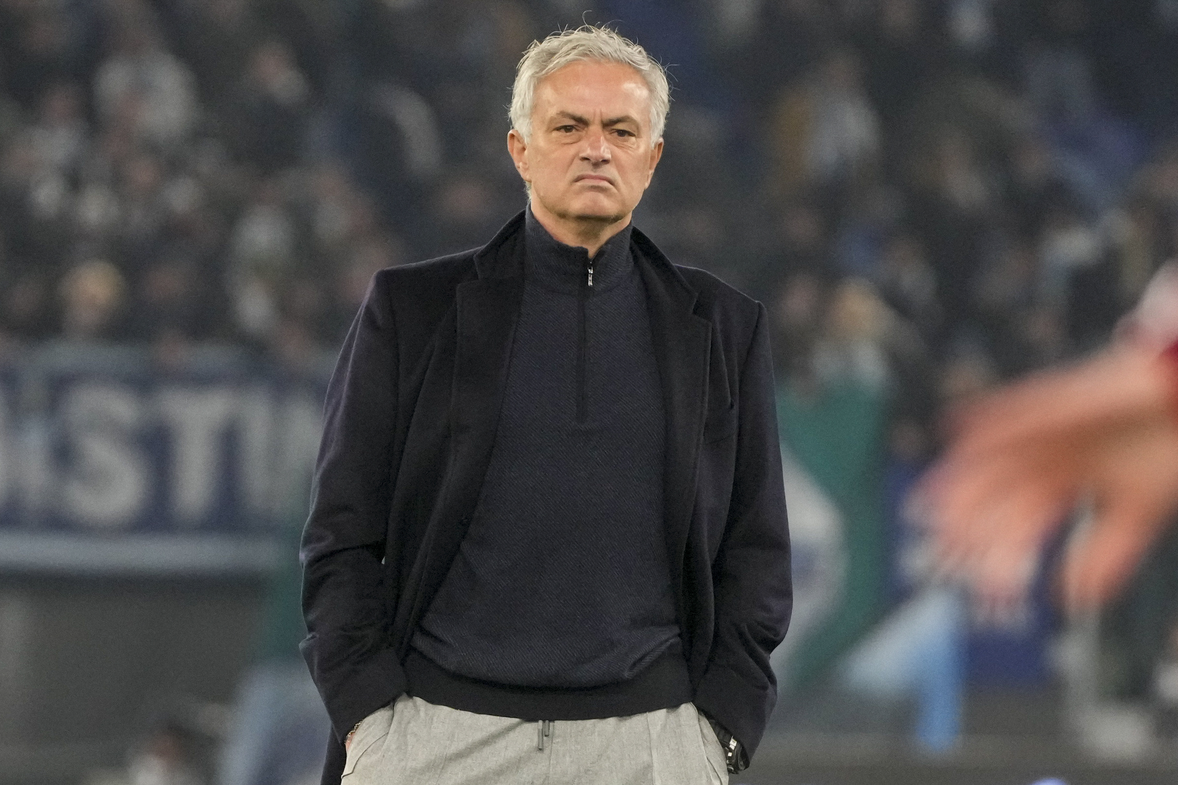 Roma's head coach Jose Mourinho stands on the pitch during his team's warm up ahead of the quarterfinal Italian Cup soccer match between Lazio and Roma at Rome's Olympic Stadium, Wednesday, Jan. 10, 2024. 