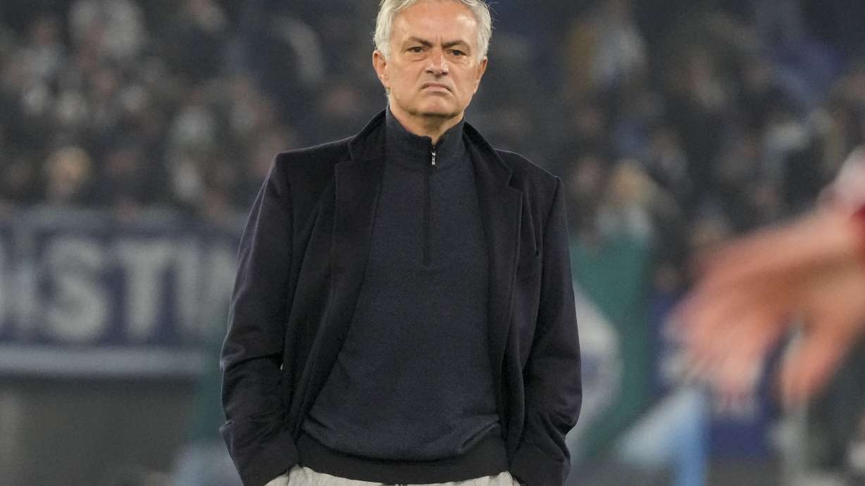 Roma's head coach Jose Mourinho stands on the pitch during his team's warm up ahead of the quarterfinal Italian Cup soccer match between Lazio and Roma at Rome's Olympic Stadium, Wednesday, Jan. 10, 2024.