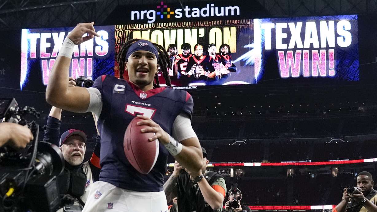 Houston Texans quarterback C.J. Stroud celebrates after their win against the Cleveland Browns in an NFL wild-card playoff football game Saturday, Jan. 13, 2024, in Houston.