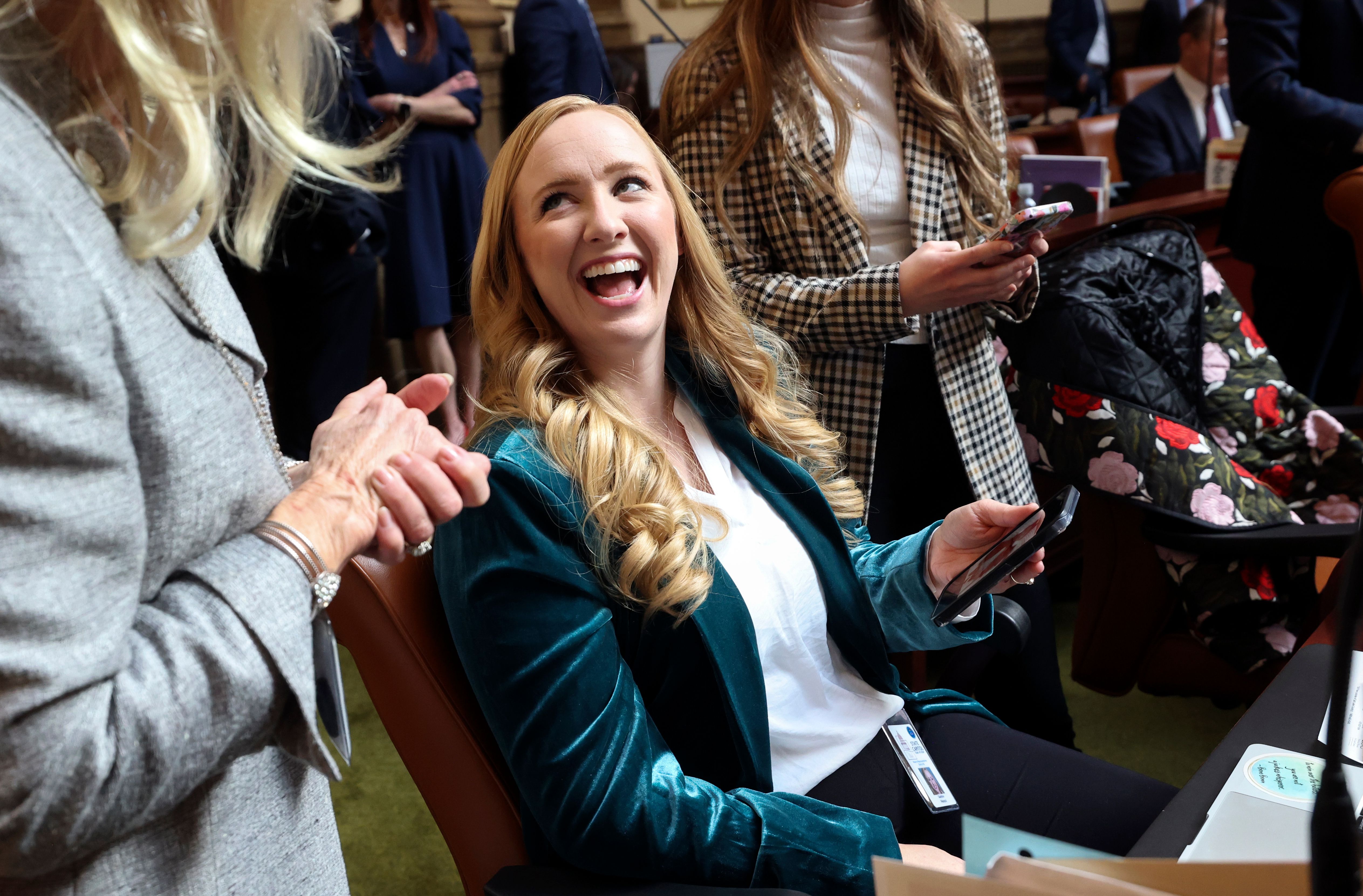 Rep. Candice Pierucci, R-Herriman, laughs while chatting on the first day of the general legislative session in the House chamber at the Capitol in Salt Lake City on Tuesday.