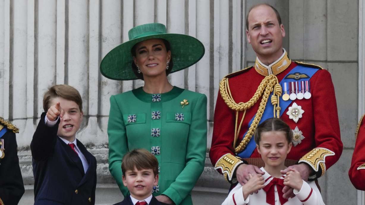 Prince William, right, Kate, Princess of Wales, center, Princess Charlotte, bottom right, Prince George, left, and Prince Louis greet the crowd from the balcony of Buckingham Palace in London, June 17, 2023. The Princess of Wales has been hospitalized for planned abdominal surgery and will remain at The London Clinic for up to two weeks, Kensington Palace said Wednesday.